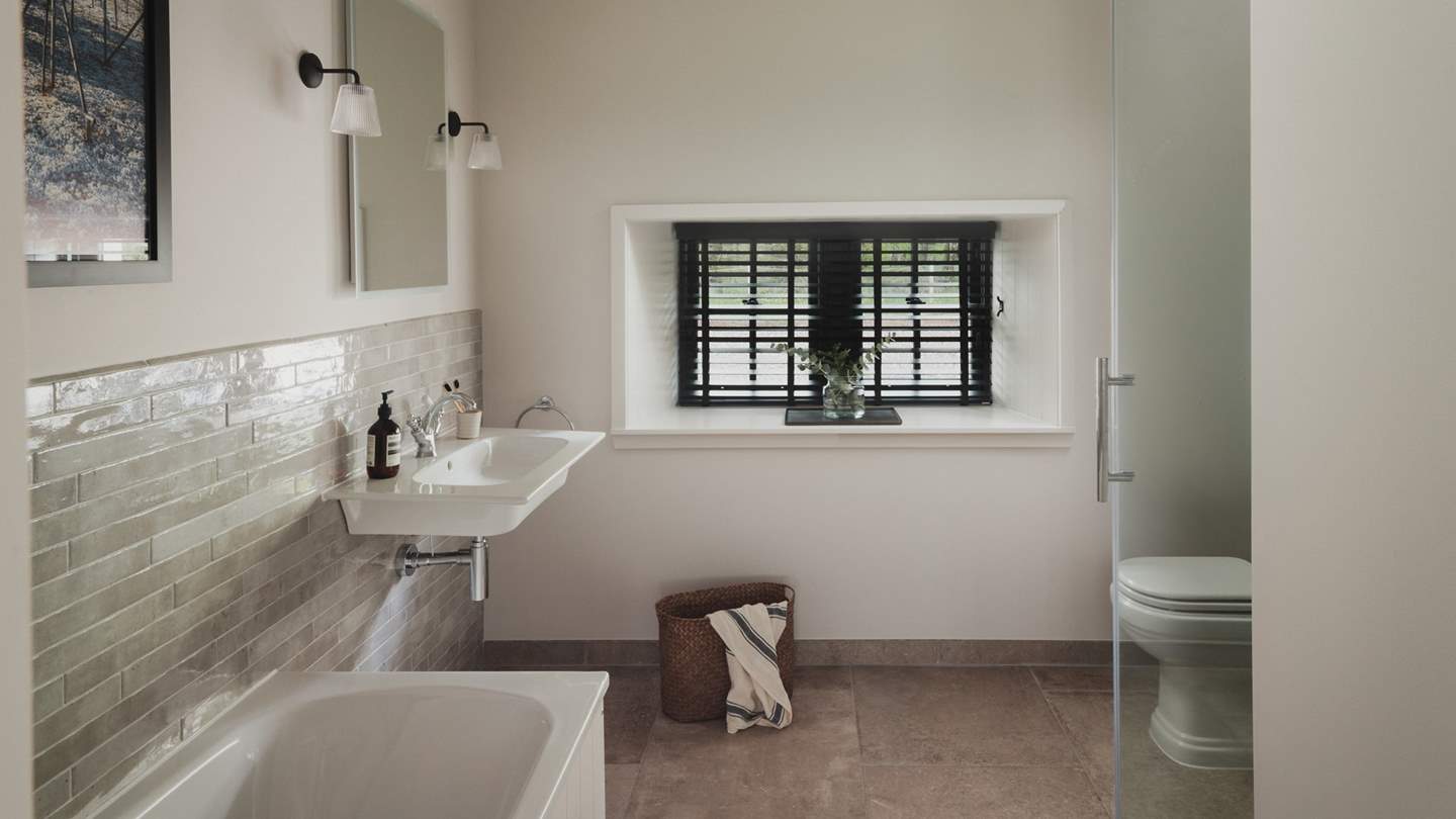 Home to both a bath and shower for rejuvenating selfcare