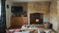 A wood burning stove invites for slow living moments in the cooler months at our dog-friendly abode