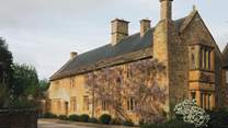 Uncover a collection of rooms within this wisteria-adorned 16th century house