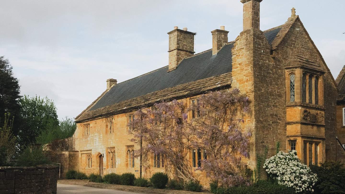 Uncover a collection of rooms within this wisteria-adorned 16th century house