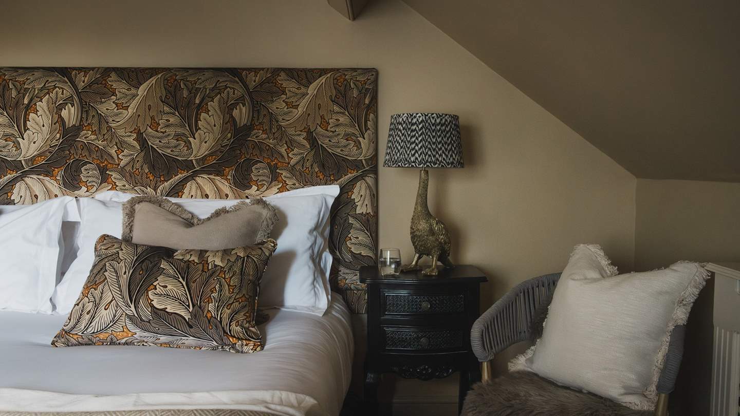 Resting beneath characterfully sloping beams