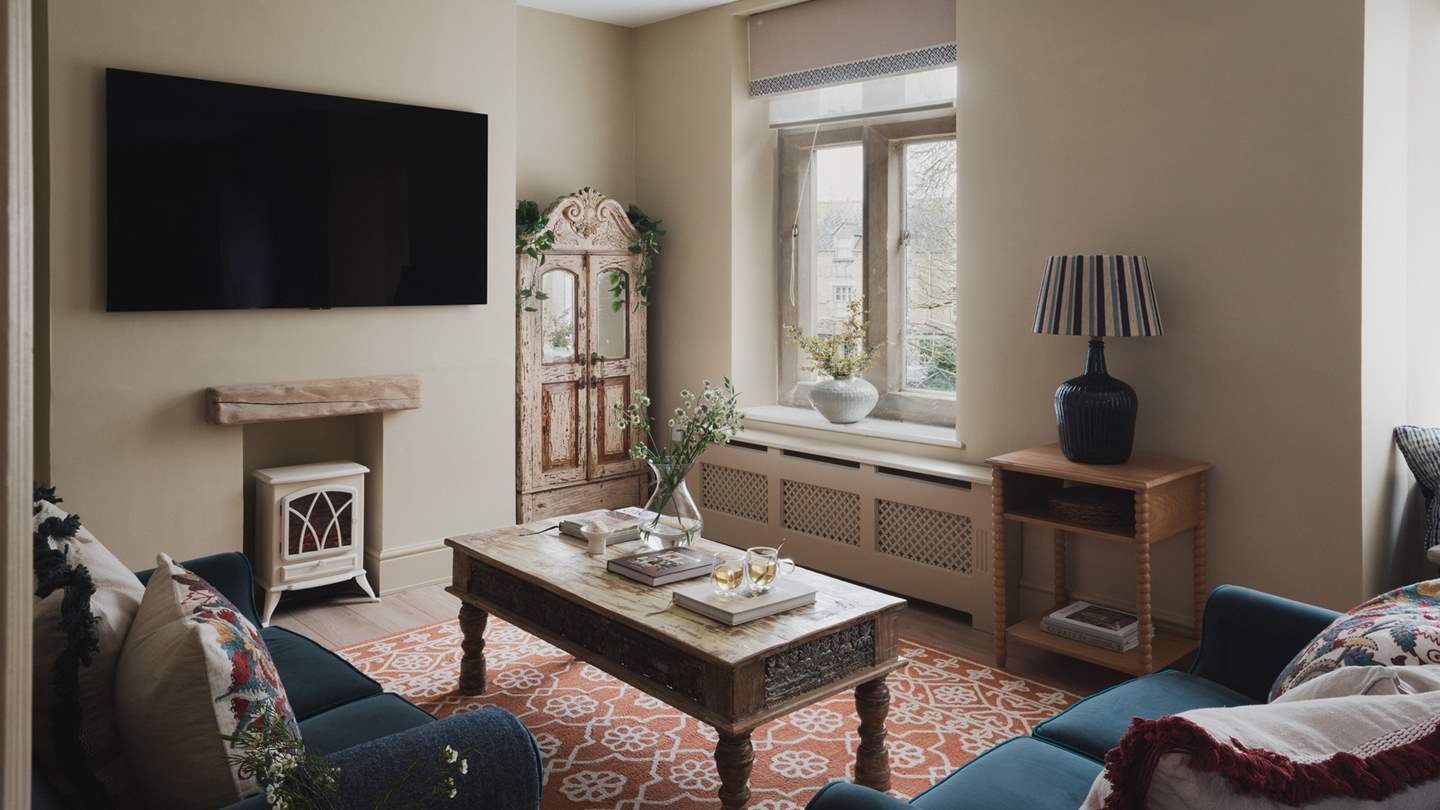 Beckoning for repose, handmade sofas from Bampton Design gather around an antique coffee table