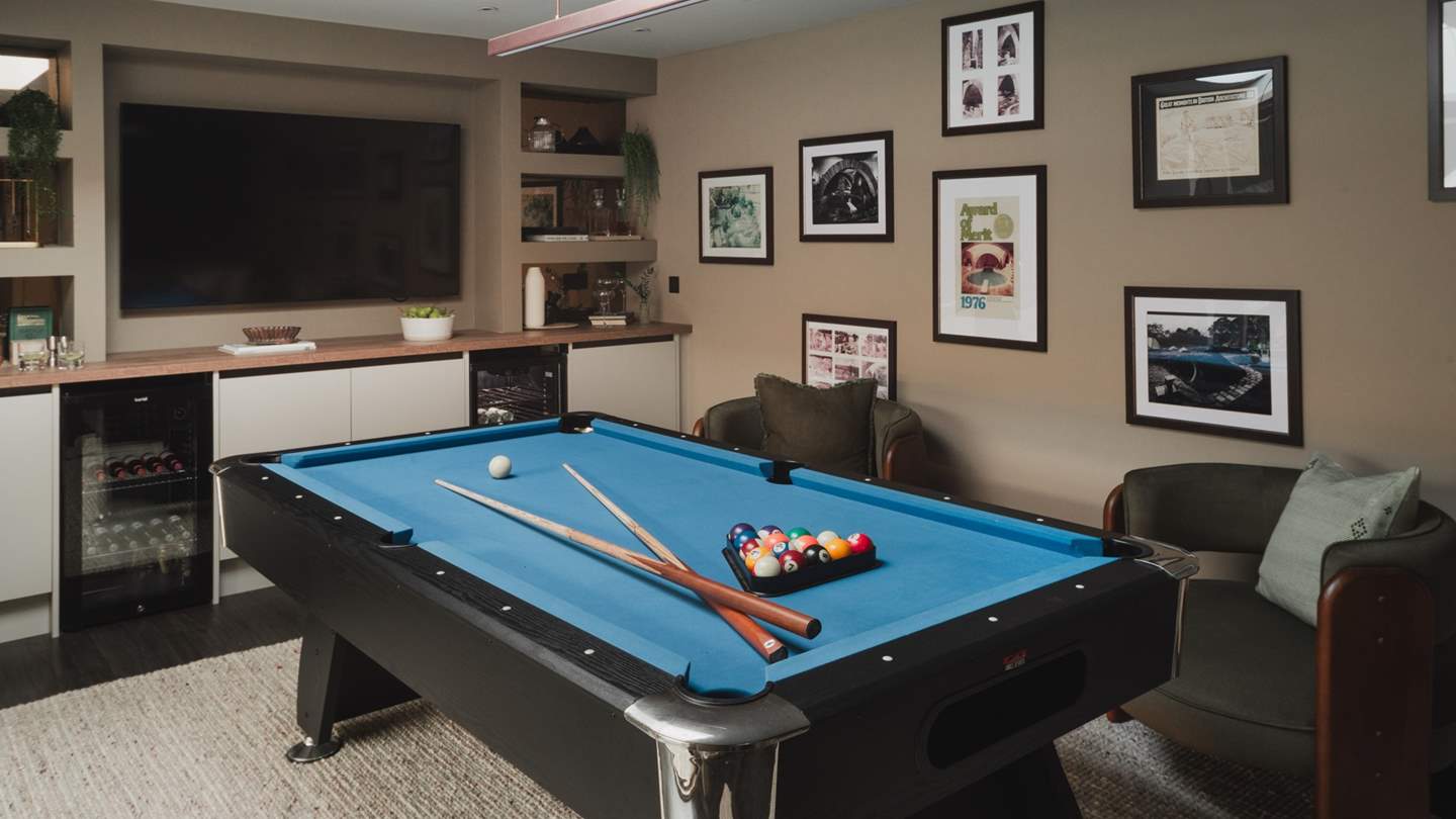 The games area beckons with a pool table, bar, and a 75” Smart TV with a full Sky package 