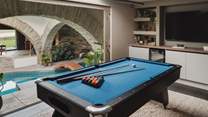 Uncover the games room, perfectly hidden behind sliding doors