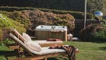 With an urban cedar hot tub tucked in a secluded corner
