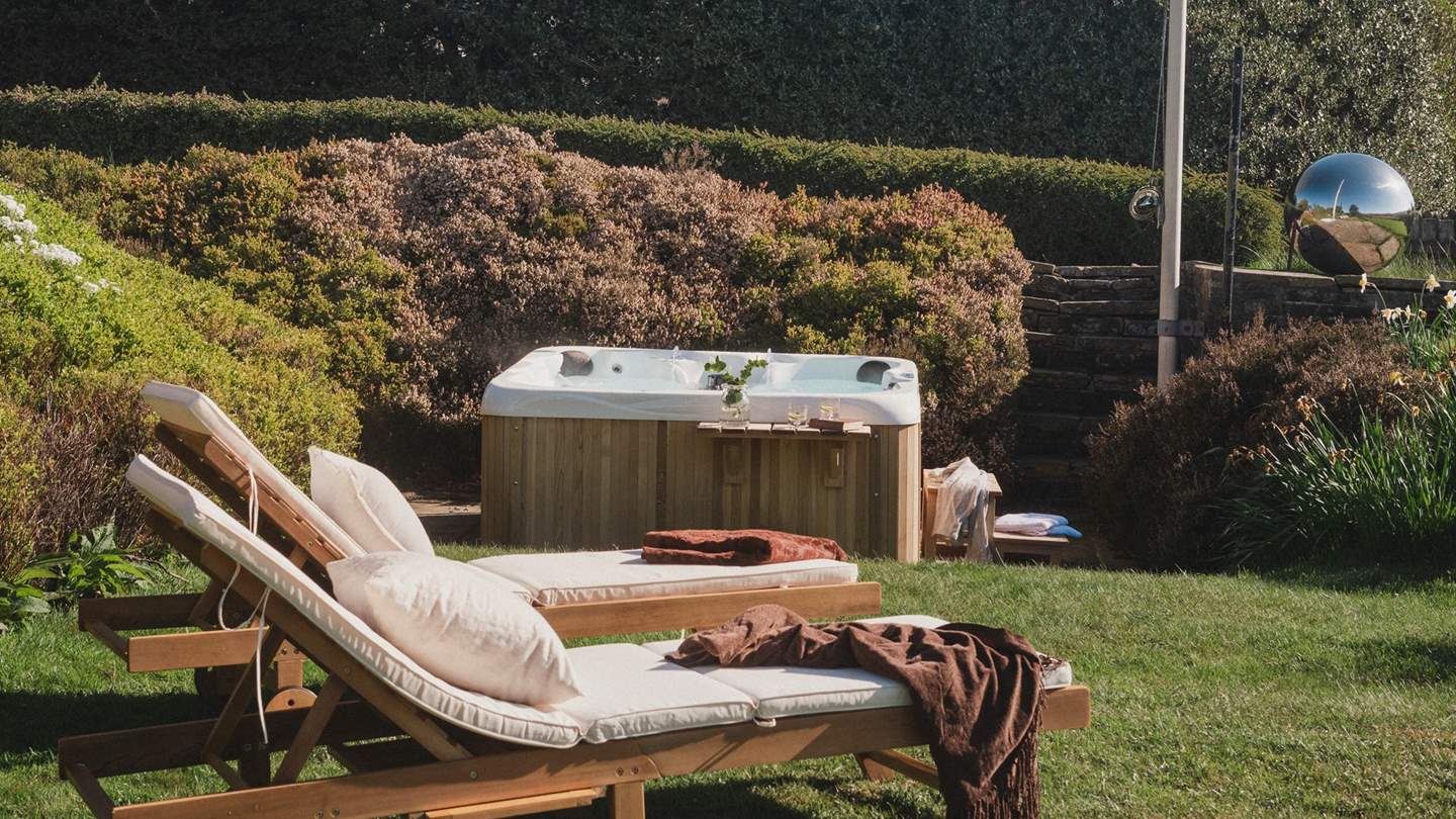 With an urban cedar hot tub tucked in a secluded corner