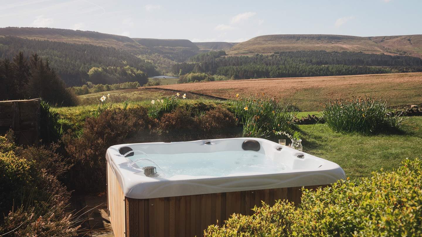 An urban cedar hot tub beckons for divine evenings immersed in a swirl of silky bubbles