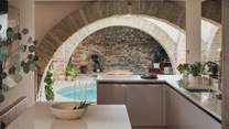 With a welcoming breakfast bar for gathering as meal preparations take place. 