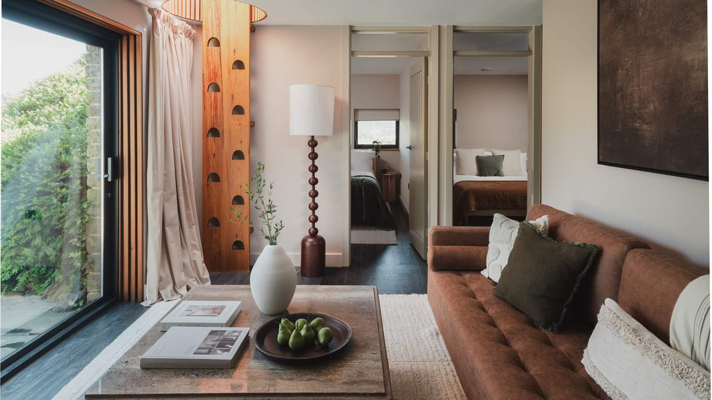 An additional living space awaits to the rear of the retreat beside the third and fourth bedrooms 