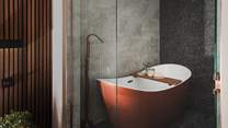 With a floor-to-ceiling glass door, uncover the ensuite bathroom 