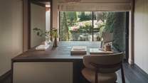 A separate dressing room beckons with a dreamy outlook over the garden