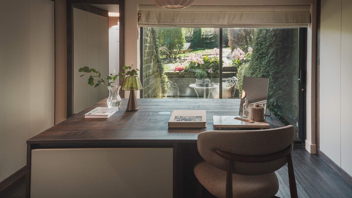 A separate dressing room beckons with a dreamy outlook over the garden
