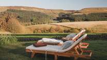 Eight sun loungers invite you to relax and unwind effortlessly throughout the summer months