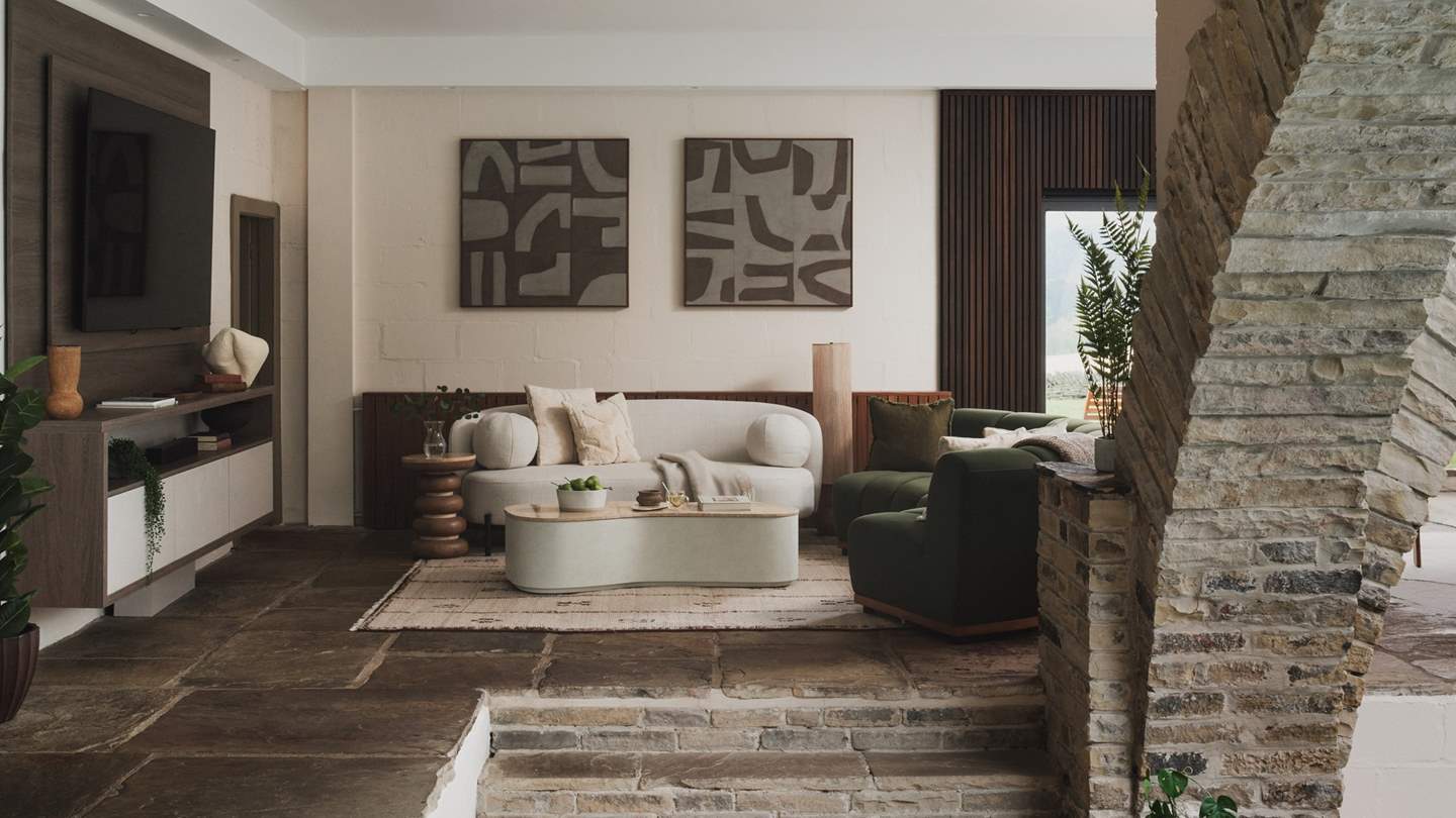 Two curved sofas invite you to relax within the main living room