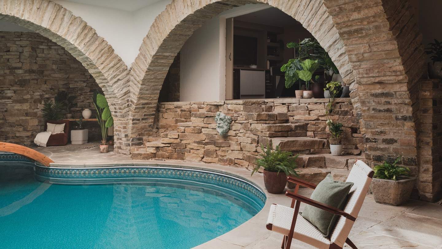 Stone steps lead to the additional entertaining area 