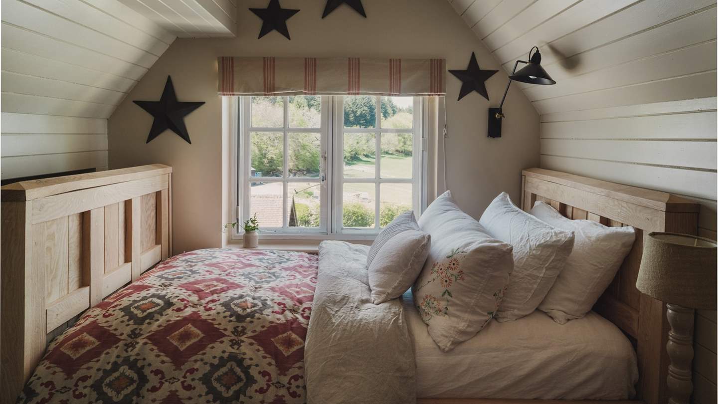 Offering further flexibility, a fourth bedroom resides across the hall, with a bespoke handmade single daybed 