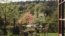 A world of enchantment awaits in the sun-dappled garden