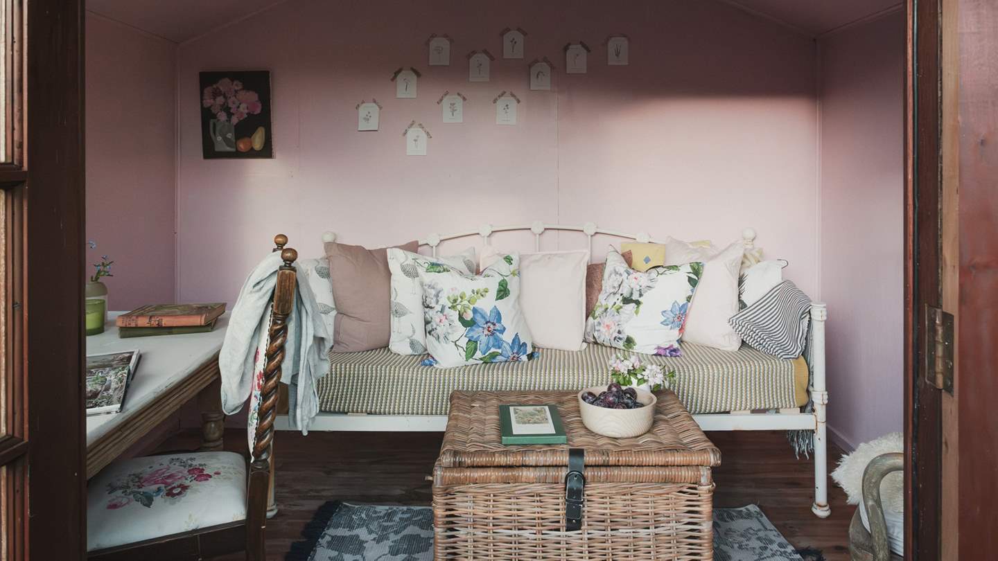 This wooden sanctuary offers a peaceful nook for writing retreats or unwinding into a literary lullaby
