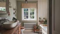 Underfloor heating and a heated towel rail add a touch of warmth to morning showers and indulgent, bubble-topped soaks