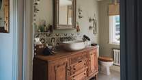 The first-floor bathroom is made for slow, restorative self-care rituals