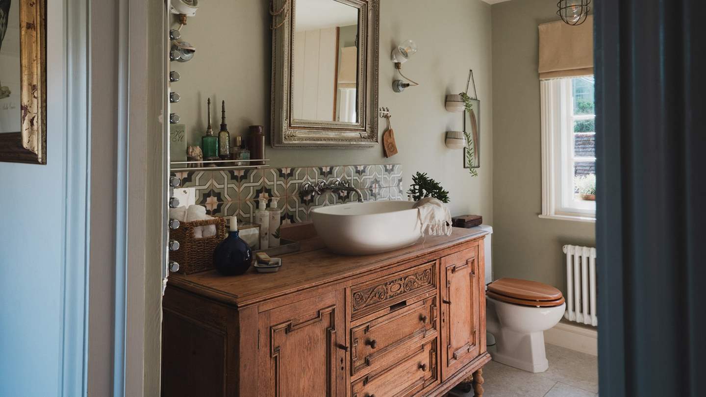 The first-floor bathroom is made for slow, restorative self-care rituals