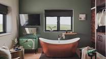 A bespoke floor-to-ceiling wardrobe and drawers fill one wall