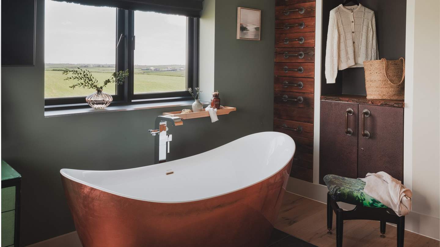 Relish deep soulful soaks in the large cooper bathtub