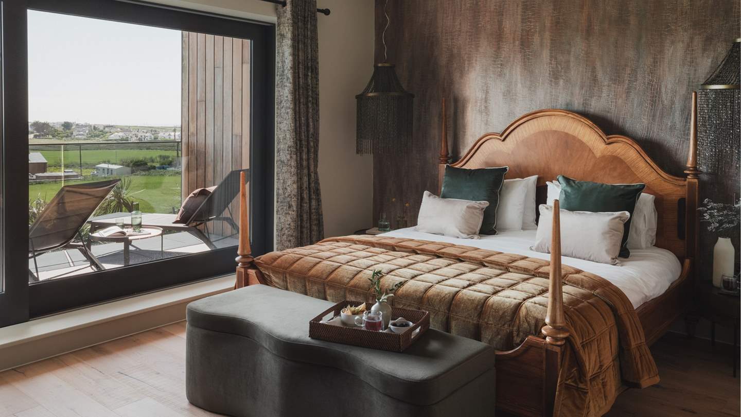 The first bedroom is the perfect place to sink into serenity, complete with a balcony