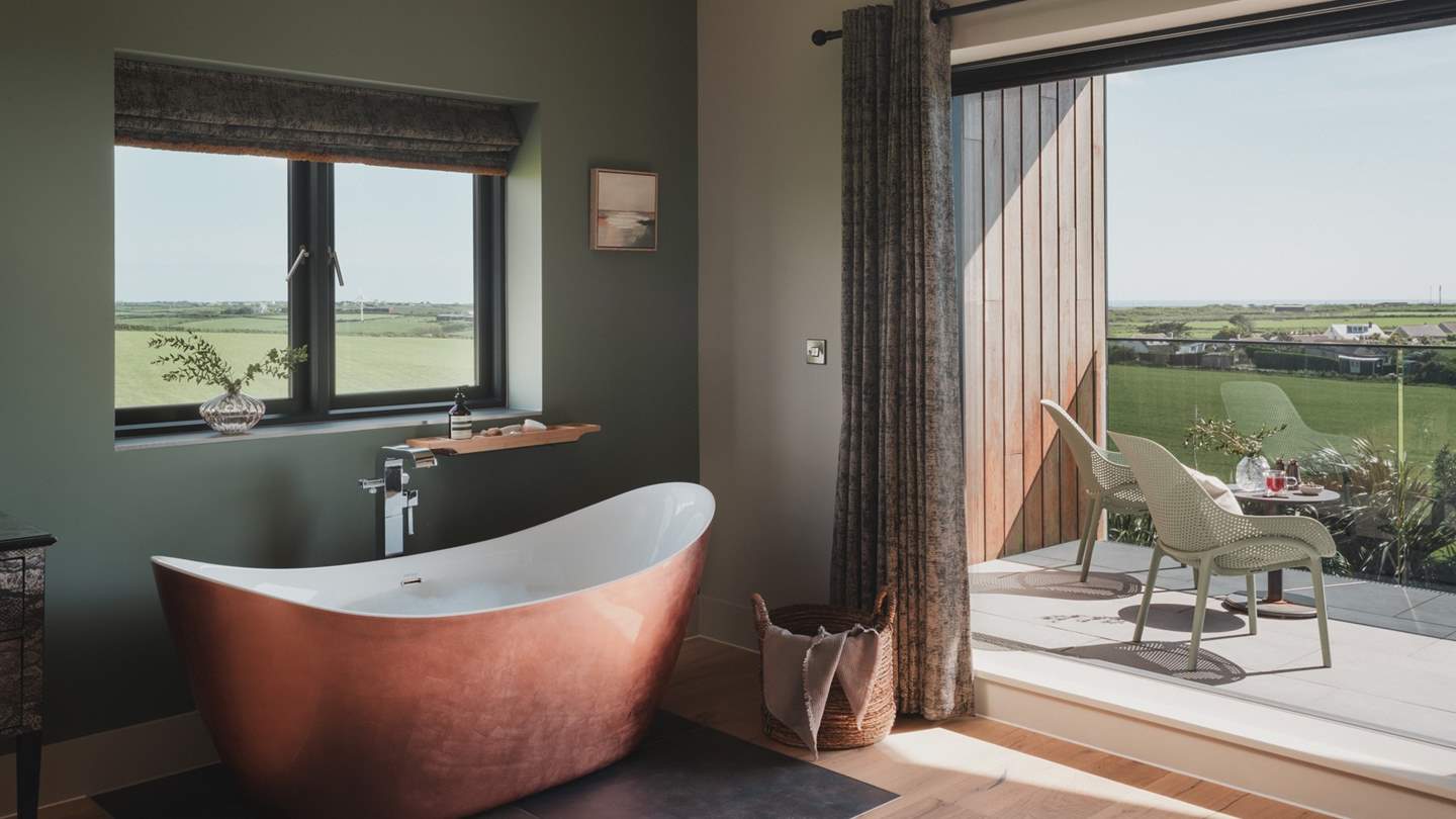 Tempting copper bathtubs in both bedrooms promise blissful moments of repose