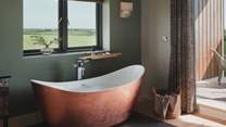 Savour soothing dips in the copper bathtub