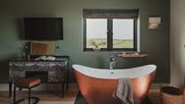 Let the fresh Cornish air envelop you as you soak in the tub’s soothing depths 