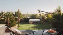 Two loungers await for sun-dappled moments alfresco