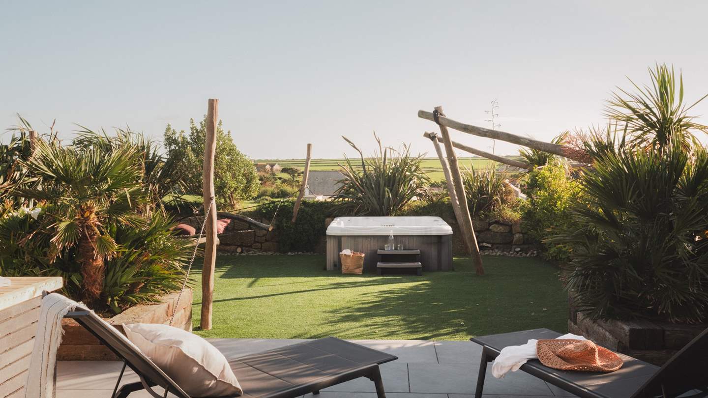 Two loungers await for sun-dappled moments alfresco