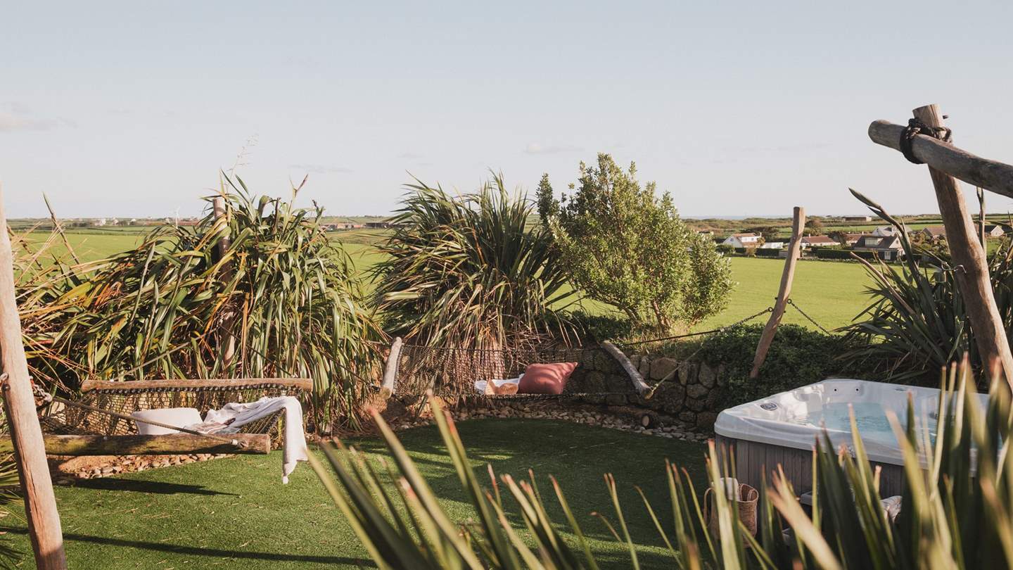 Rustic hammocks beckon for lingering moments as the sun dances across your skin 