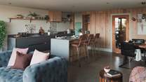 The kitchen and dining areas beautifully adjoin in an open-plan design