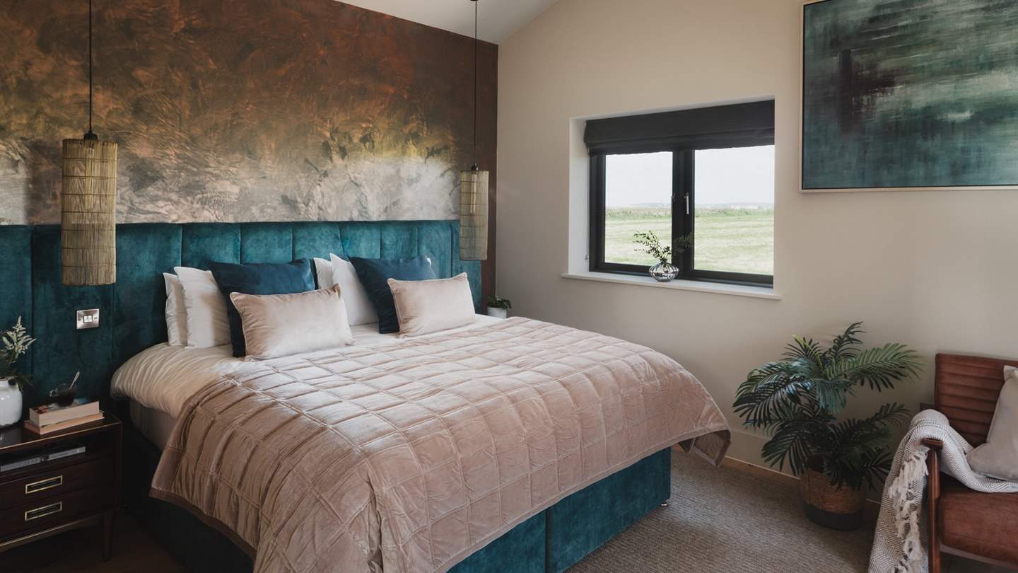 The second bedroom also features a luxe copper bathtub residing centre stage