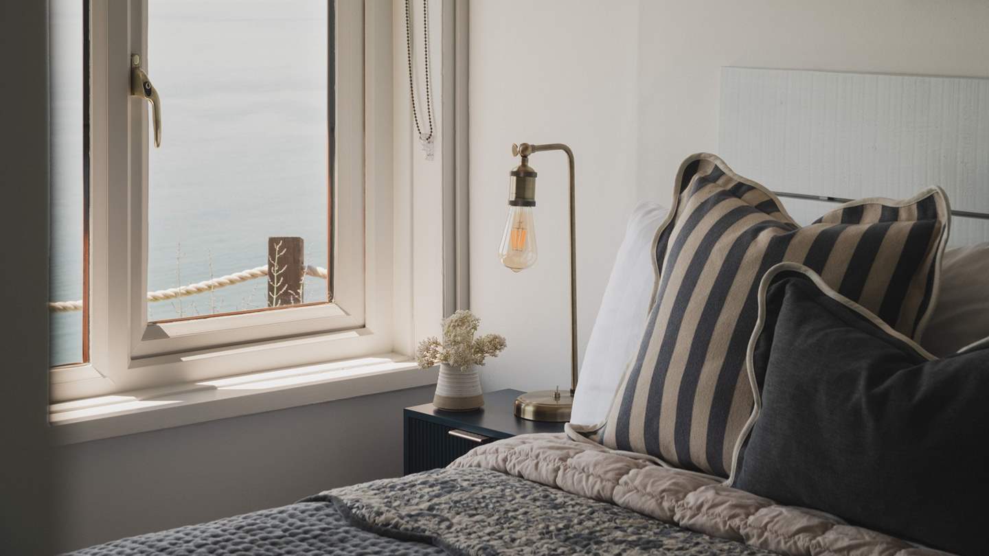 A restful sanctuary for repose, the first bedroom features a beautiful double bed