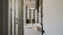 A rainfall shower and heated towel rail promise the utmost comfort