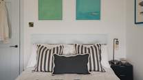 Immerse in lingering lie-ins as ocean sighs drift through the window 