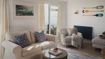 Bathed in natural light from floor-to-ceiling windows and dressed in soothing tones