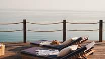 Settle into one of the two sun loungers or hammock with an artisan blend