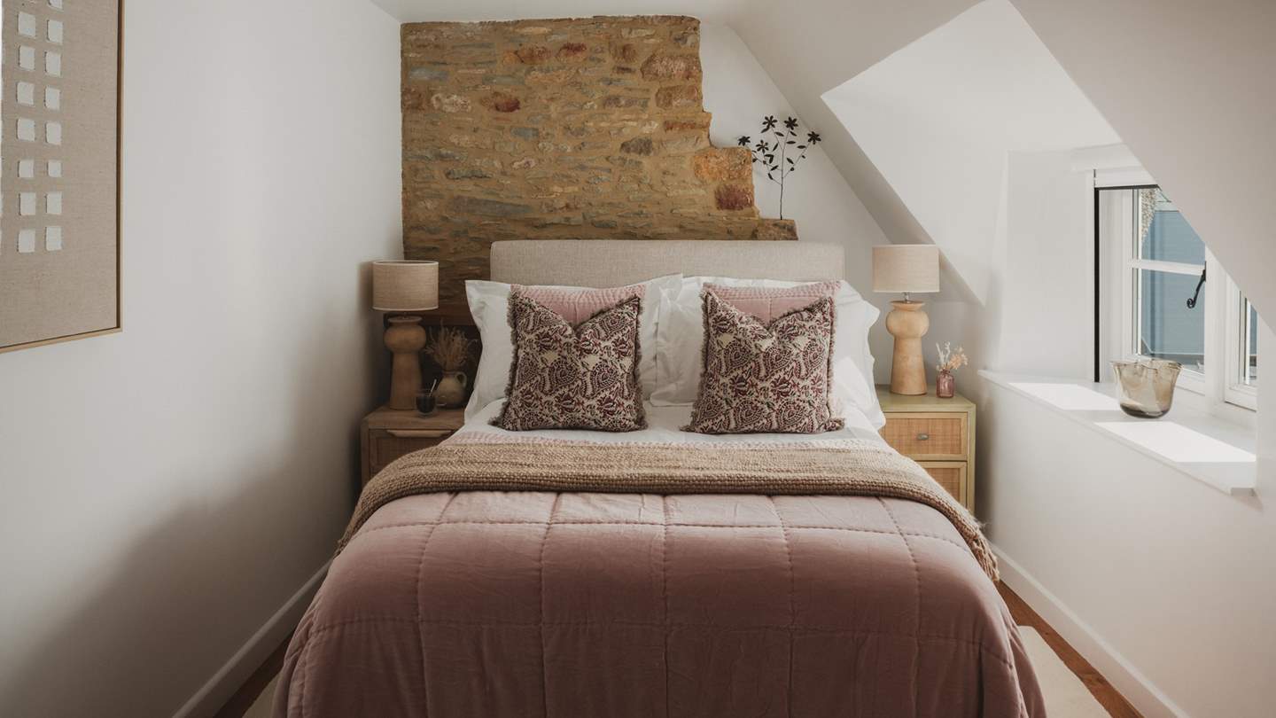 Promising soothing slumber, the second bedroom showcases a comfortable Loaf double bed