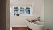 The family bathroom is a haven for relaxing self-care rituals