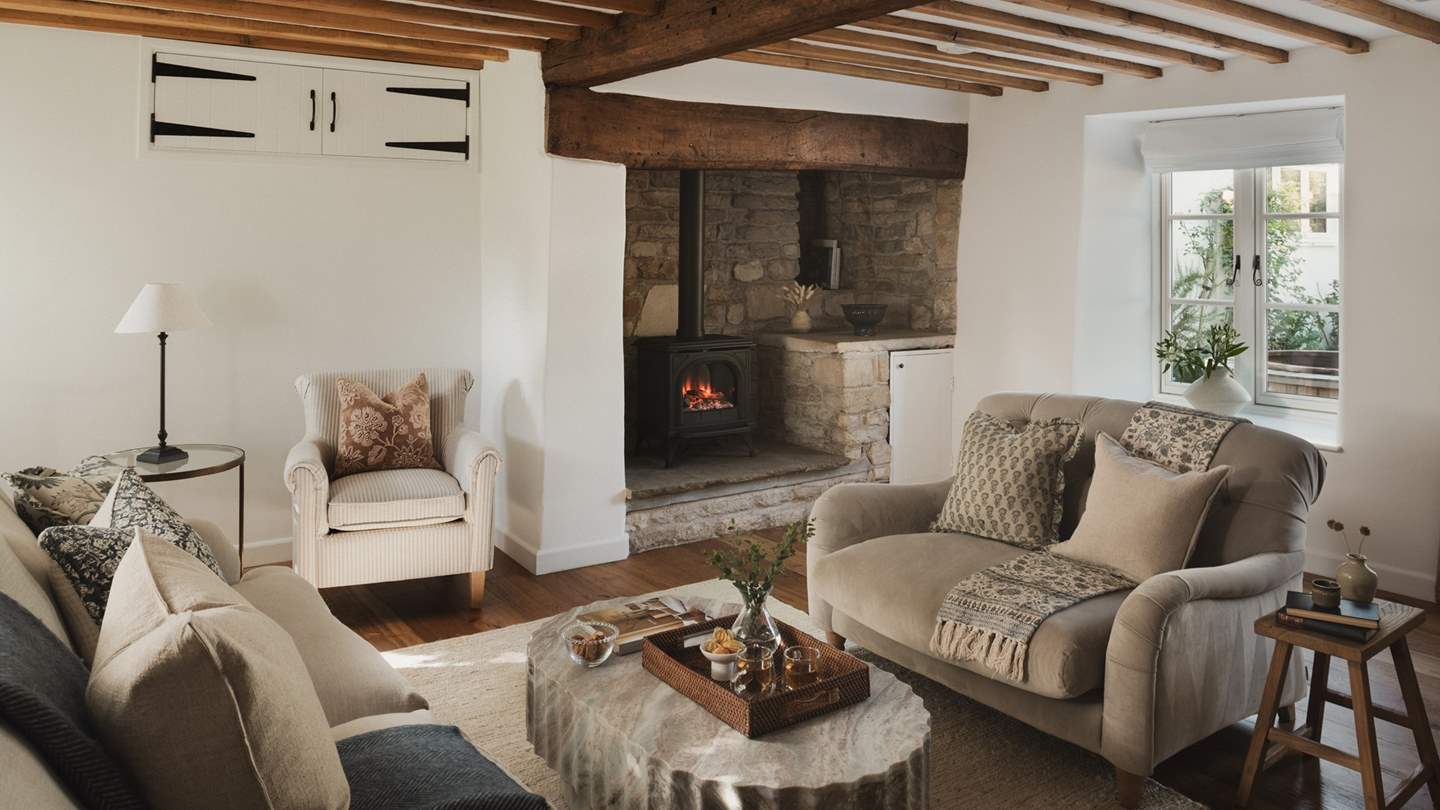 Traditional charm and contemporary comforts blend seamlessly alongside exposed beams, honey-hued stonework and original features