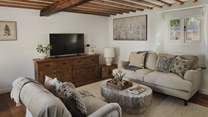 A serene spot to unwind in front of the 50” Smart TV