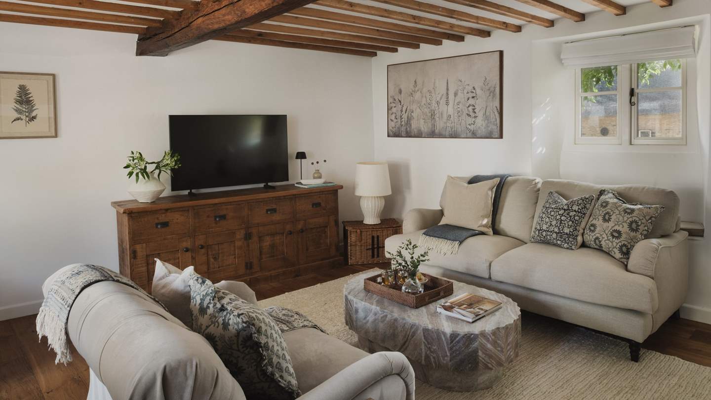 A serene spot to unwind in front of the 50” Smart TV