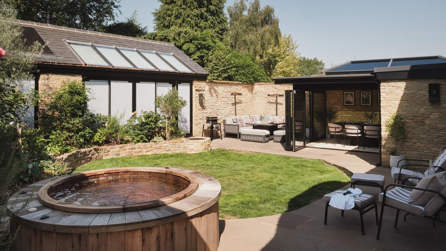 Enjoy balmy dips in the wooden electric hot tub