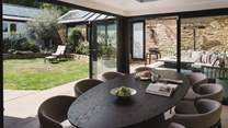 In  the warmer months, open the bi-fold doors to embrace seamless indoor-outdoor living