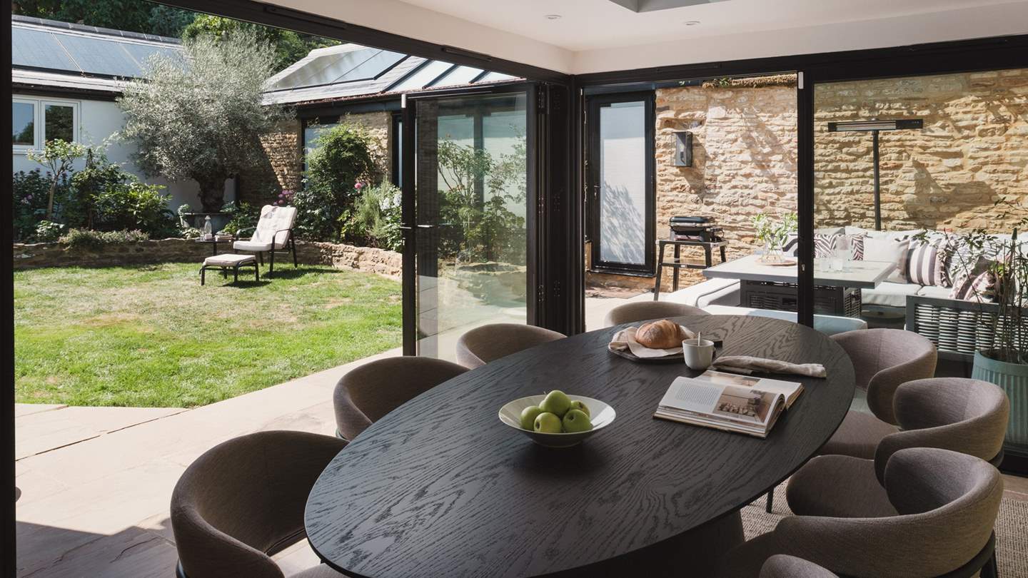 In  the warmer months, open the bi-fold doors to embrace seamless indoor-outdoor living