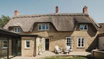 Step outside to uncover the beautifully manicured cottage garden